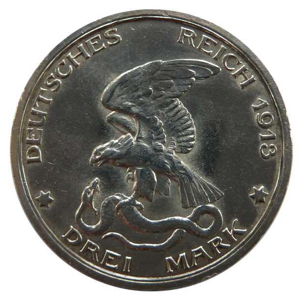 Silbermünze mit einem Adler, dessen Flügel gespreizt sind und eine Schlange mit den Klauen umklammern, Text lautet "Deutsches Reich" vor einem weißen Hintergrund.