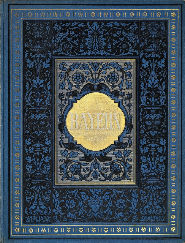 Ein blau-goldenes Buch mit dem Wort "Bayern" darauf, das mit detailreichen Verzierungen versehen ist.