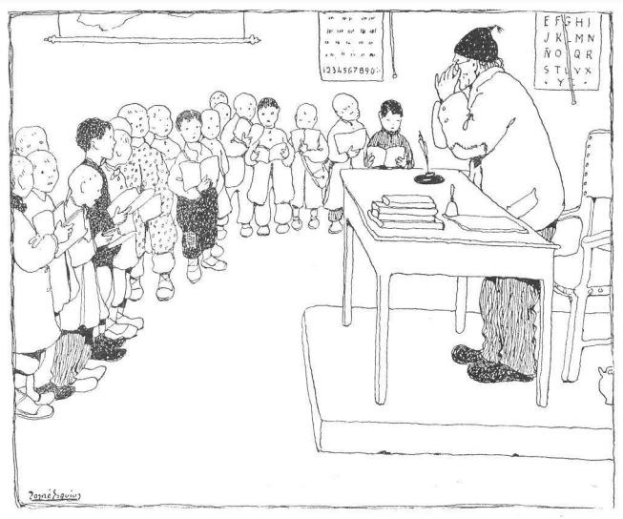 Ein Mann sitzt an einem Schreibtisch mit Büchern und Gegenständen vor einer Gruppe von Kindern, mit Papieren an der Wand dahinter, was auf eine Klassenzimmersituation hinweist, in der er anscheinend ein Lehrer ist.